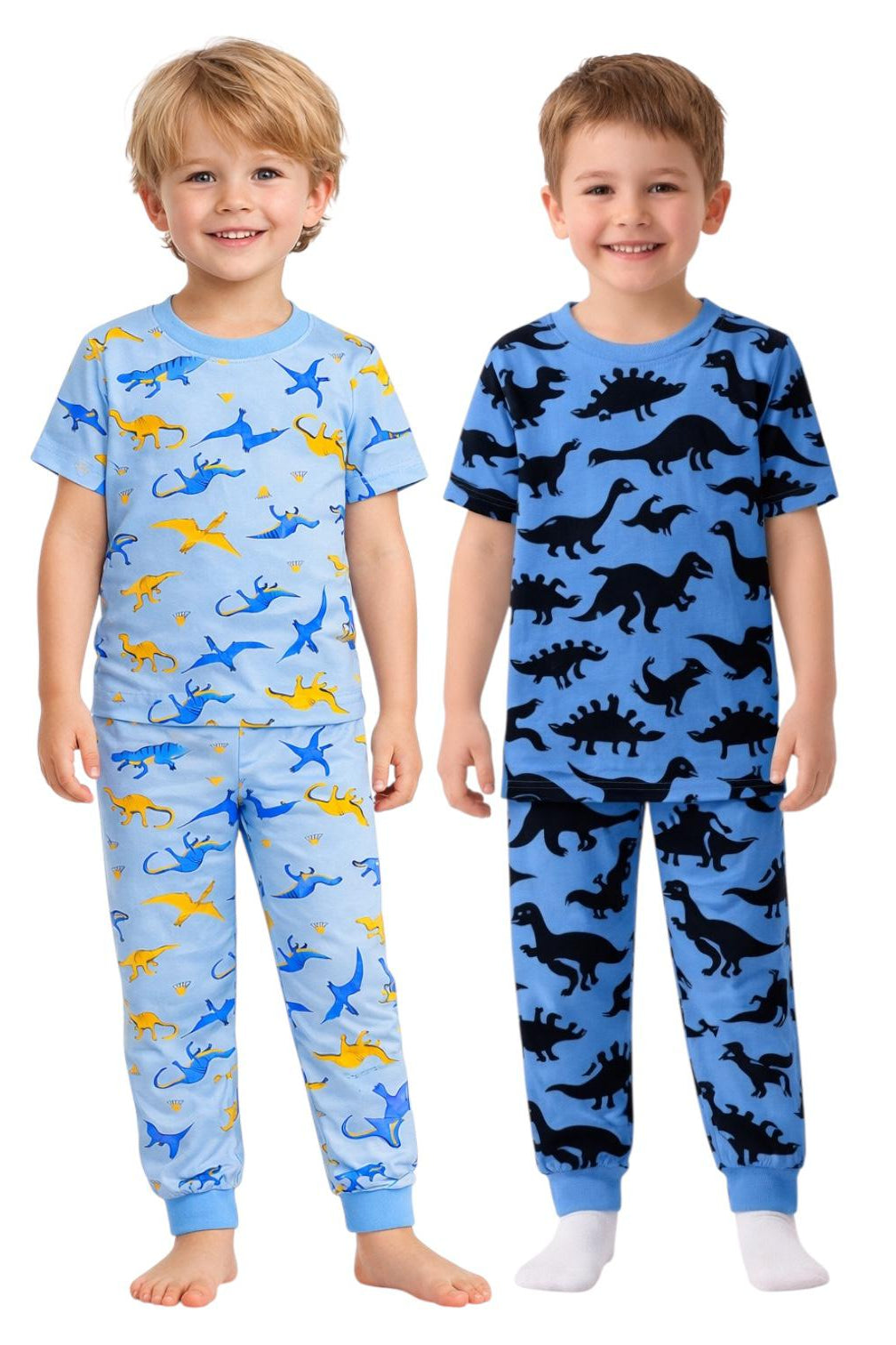 Two children wearing dinosaur-themed pajamas on a white background