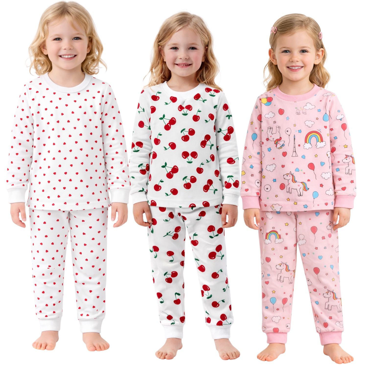 Three children wearing different pajama sets with patterns on a white background